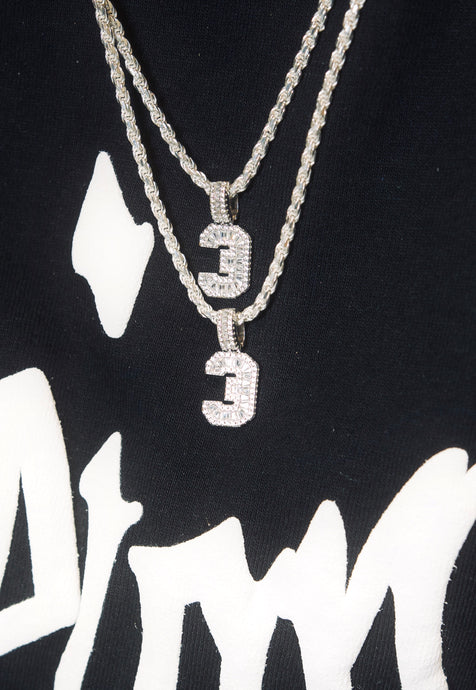 An image showing Sterling Silver Number Necklace placed round the neck of a person